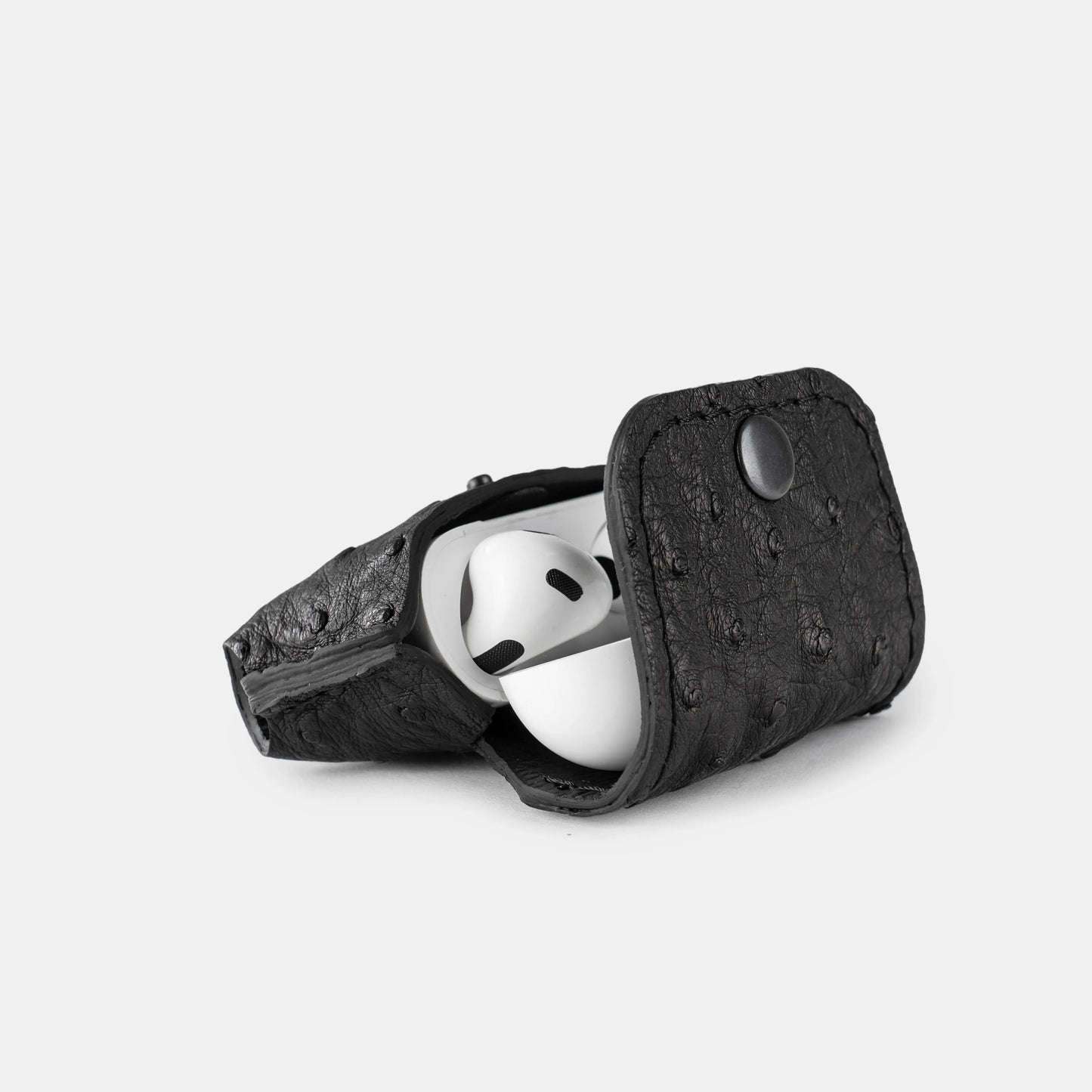 Case for AirPods made of black ostrich leather with follicles