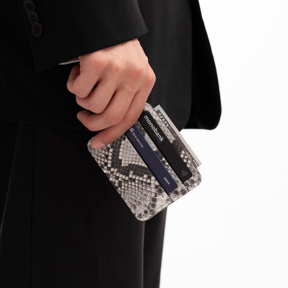 Cardholder made of black and white python leather with small scales