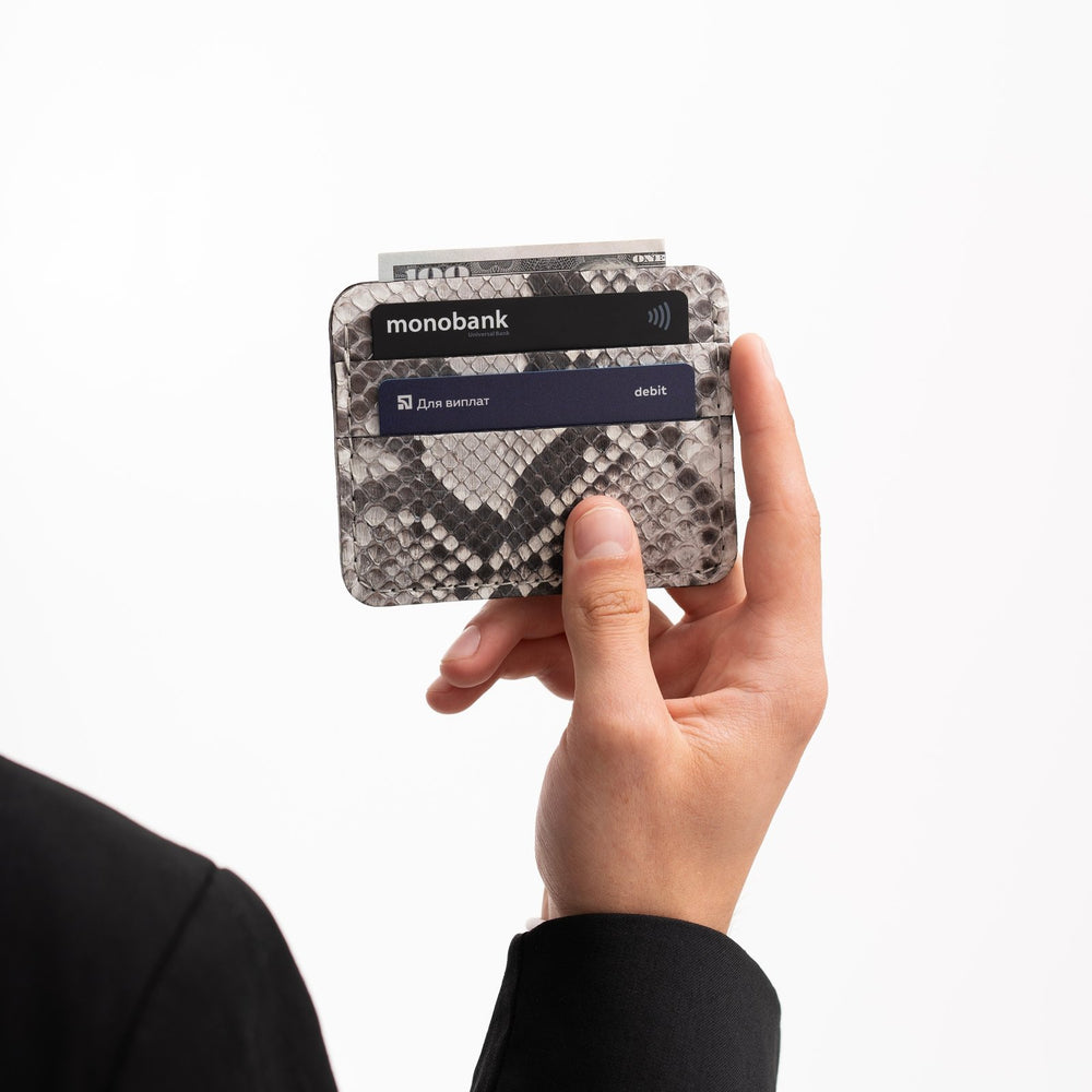 Cardholder made of black and white python leather with small scales