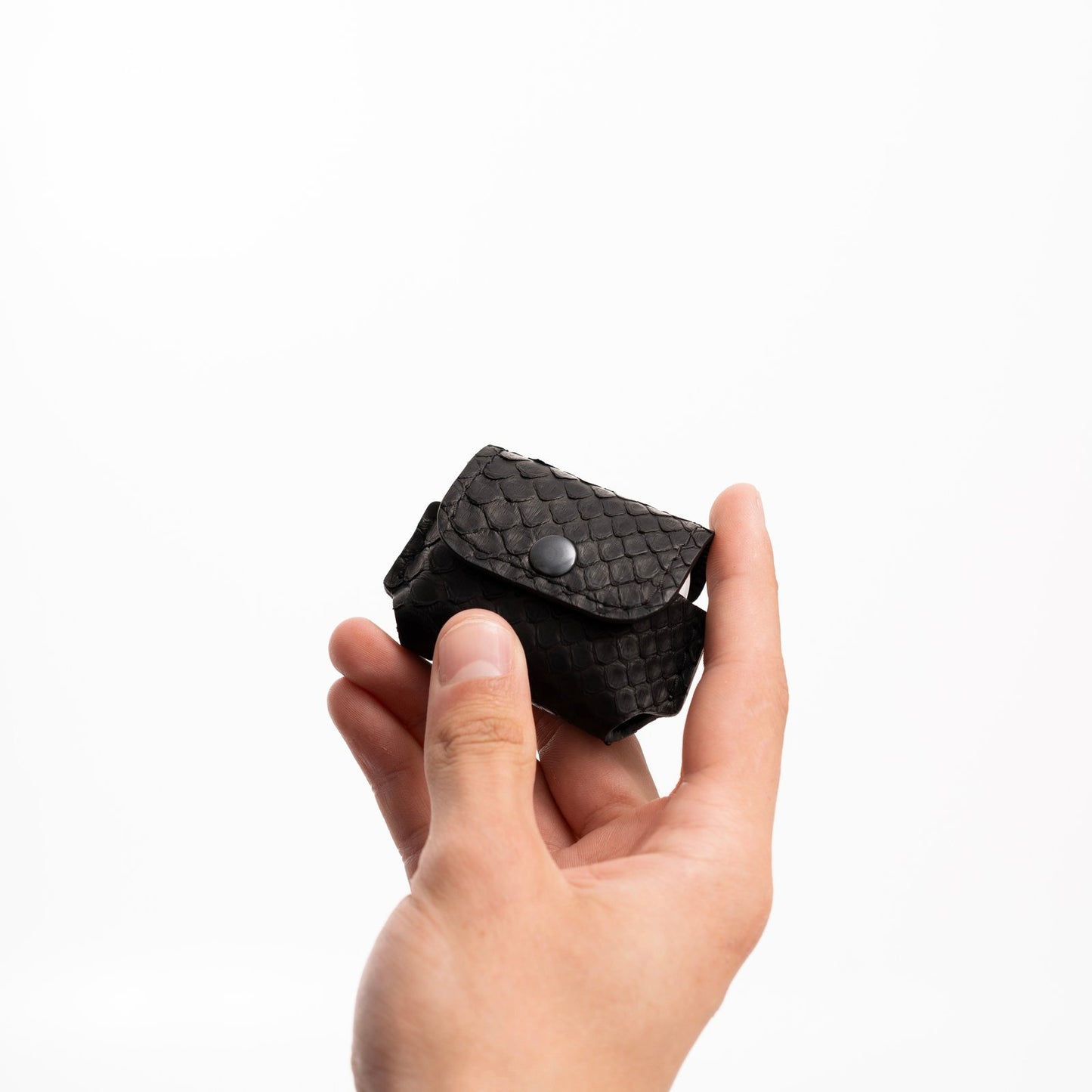 Case for AirPods made of black python leather with small scales