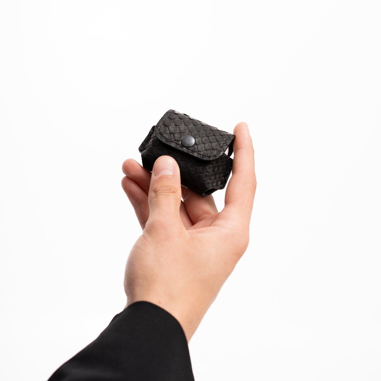 Case for AirPods made of black python leather with small scales