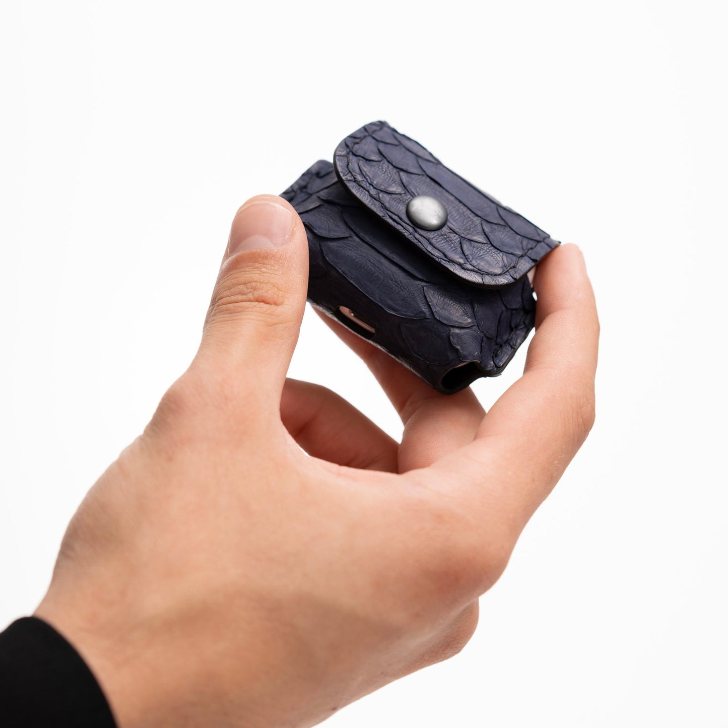 Case for AirPods made of dark blue python leather with large scales