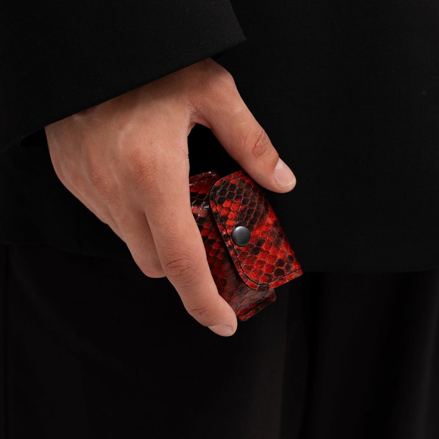 Case for AirPods made of red python leather with small scales