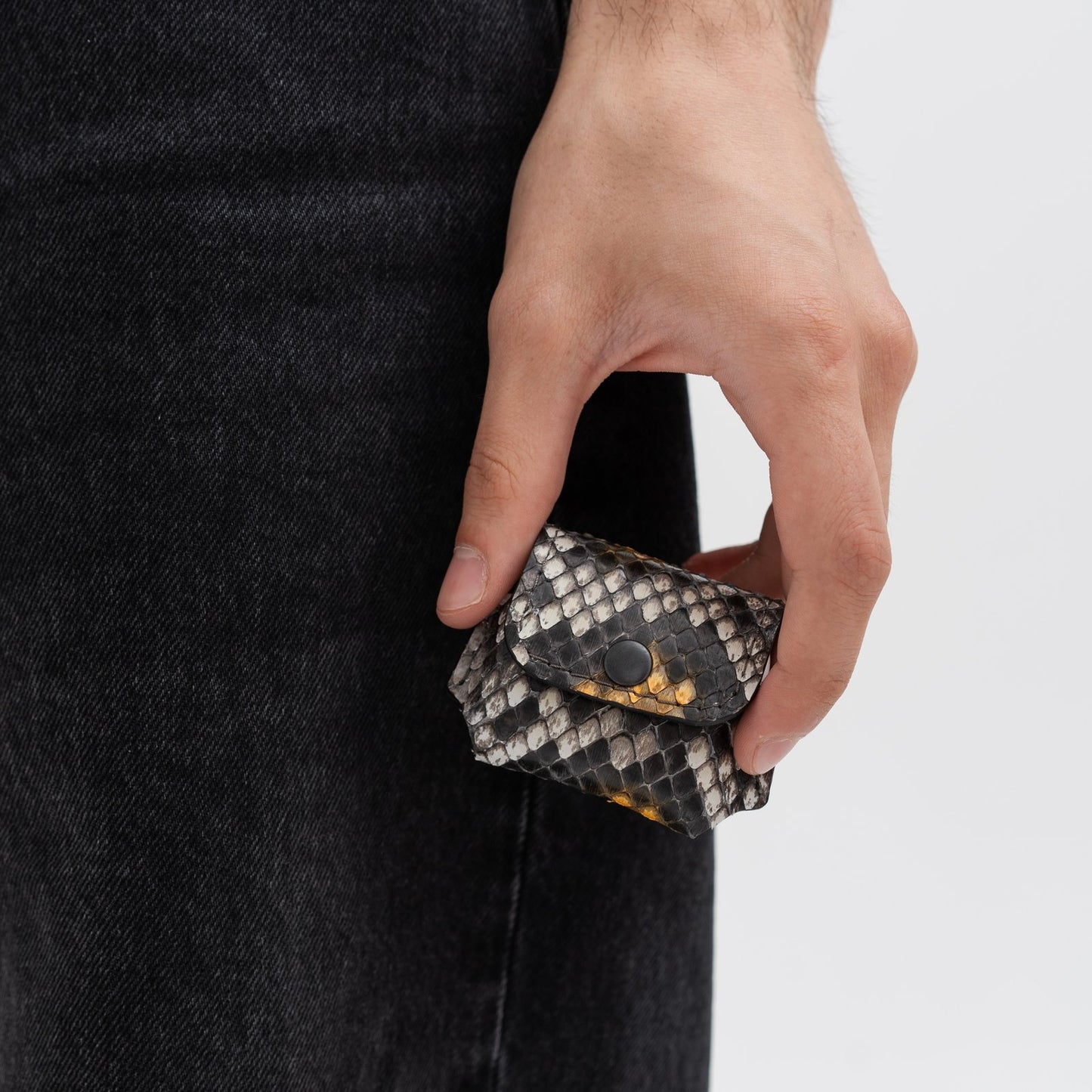 Case for AirPods made of gray-yellow python leather with small scales