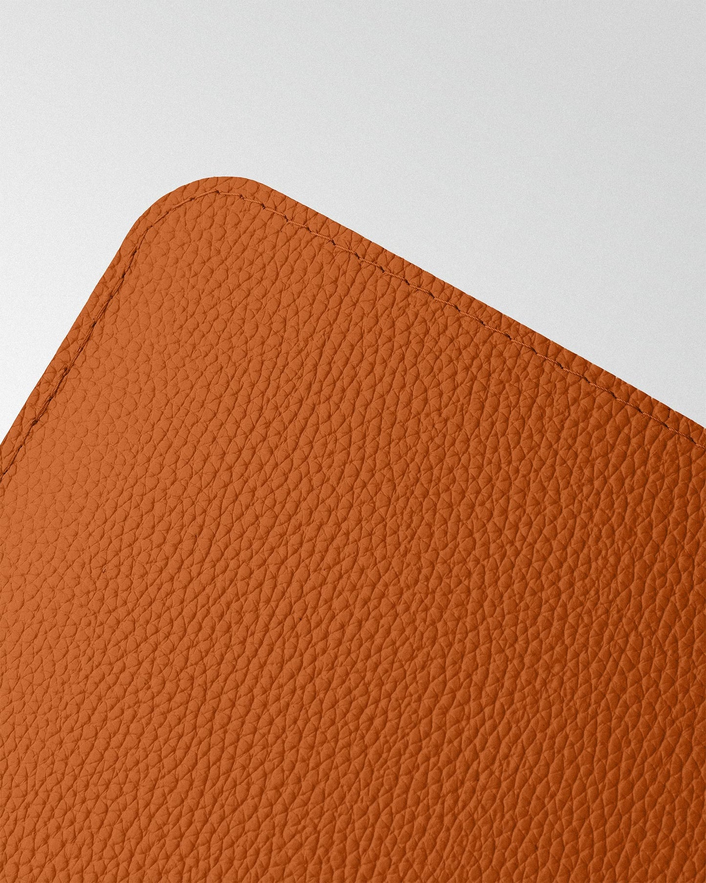 Minimalist case made of orange leather for MacBook