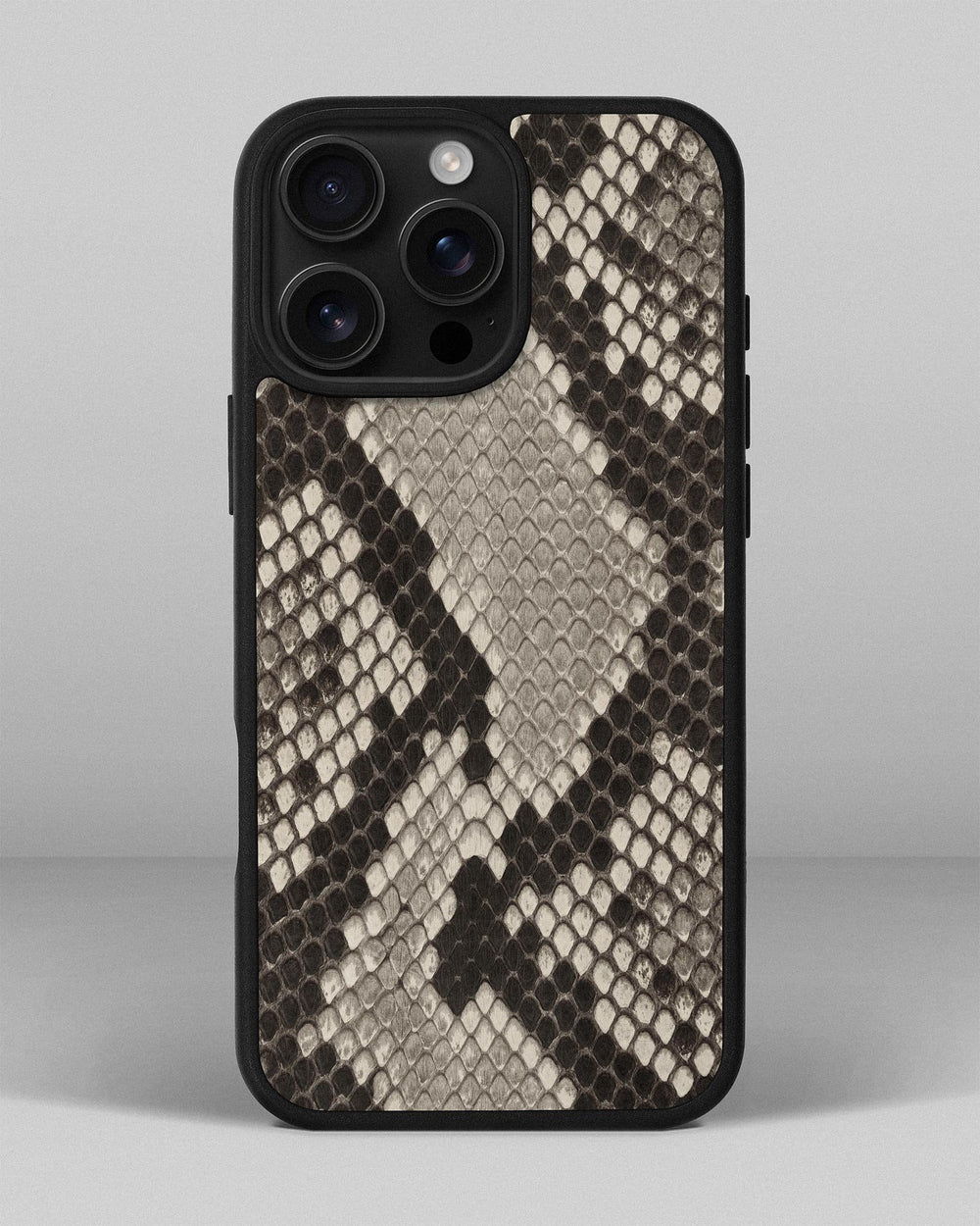 Case made of black and white python leather with small scales for iPhone 16 Pro Max