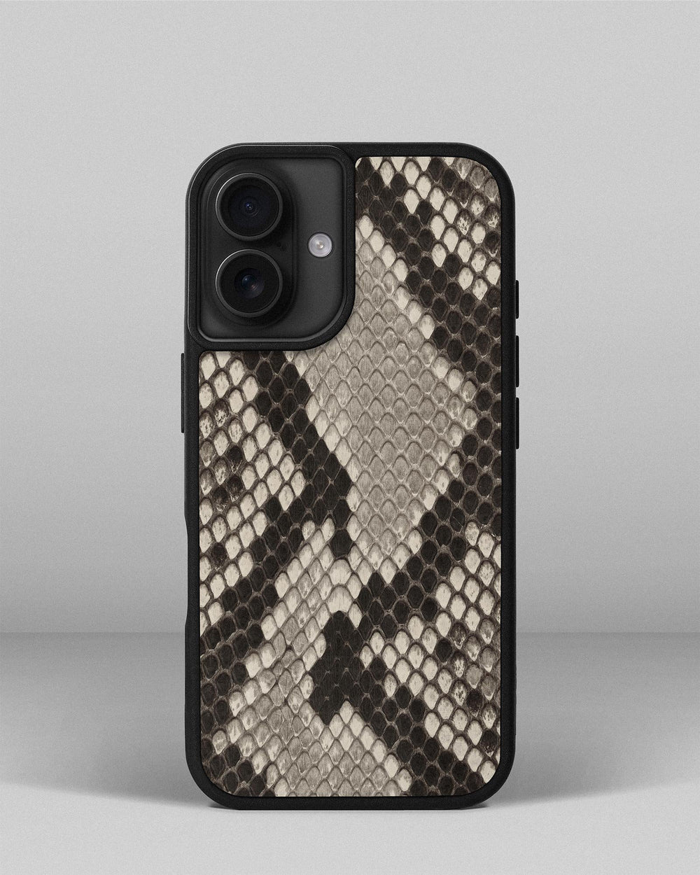 Case made of black and white python leather with small scales for iPhone 16