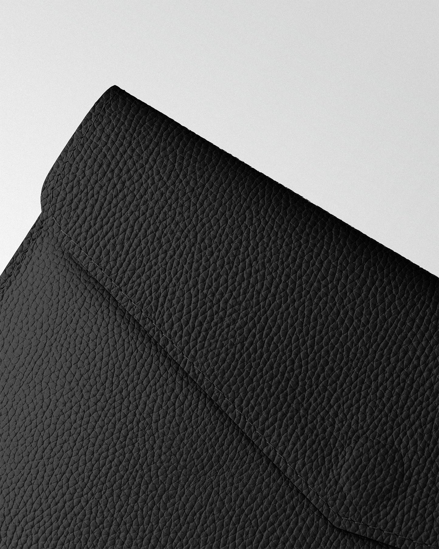 Magnetic Envelope Case made of black textured leather for MacBook