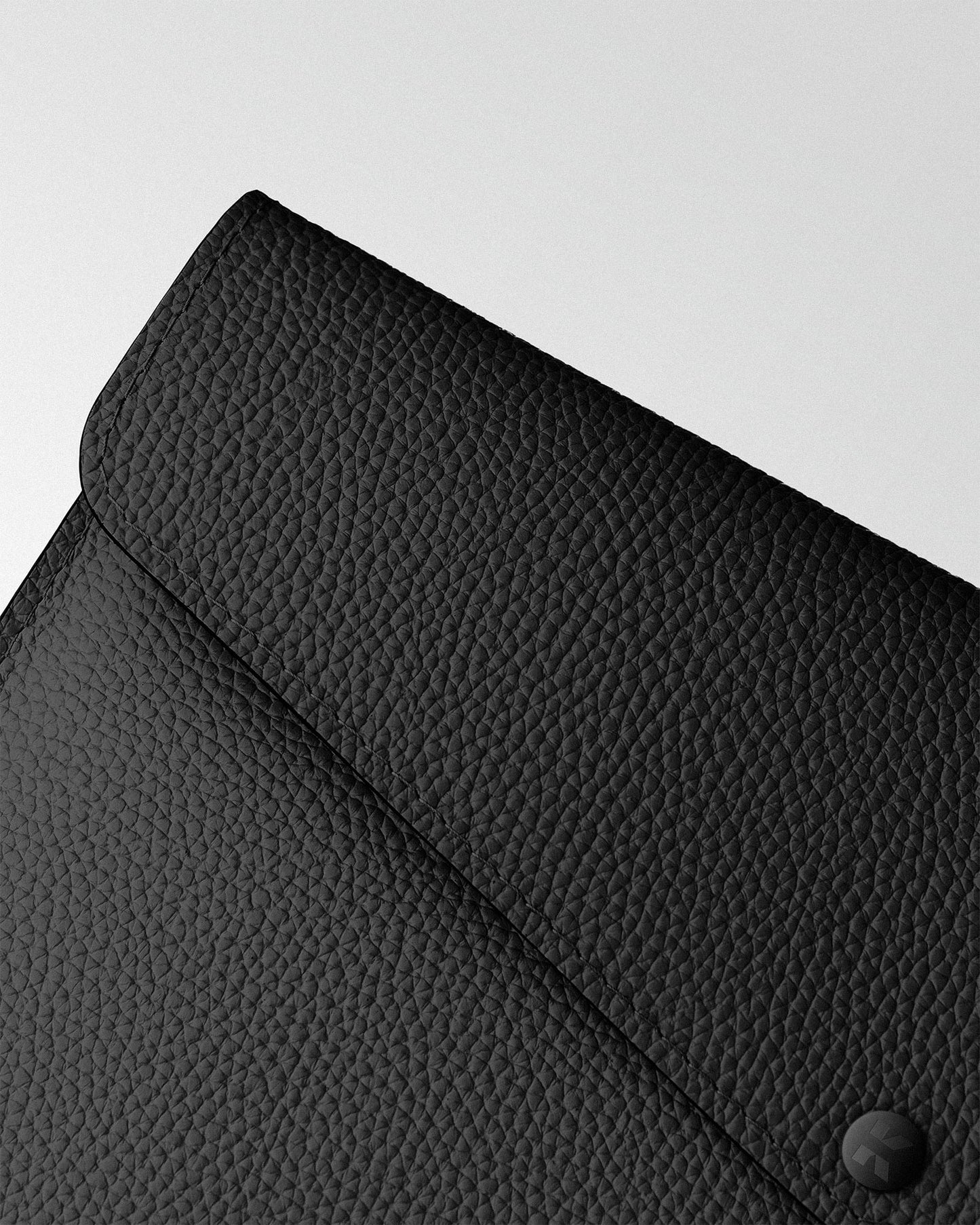 Envelope case made of black leather for MacBook