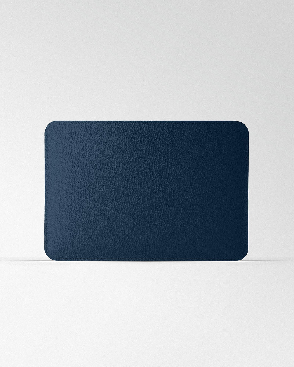 Minimalist case made of dark blue leather for MacBook