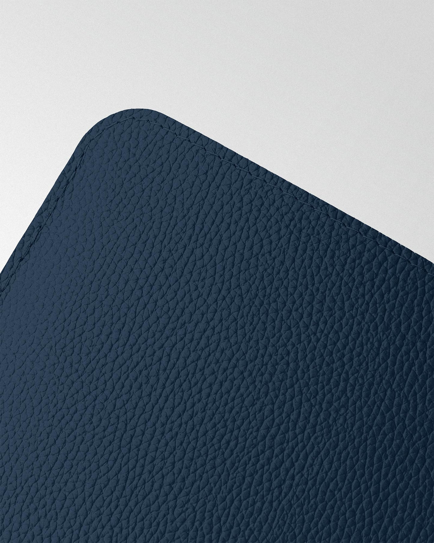 Minimalist case made of dark blue leather for MacBook
