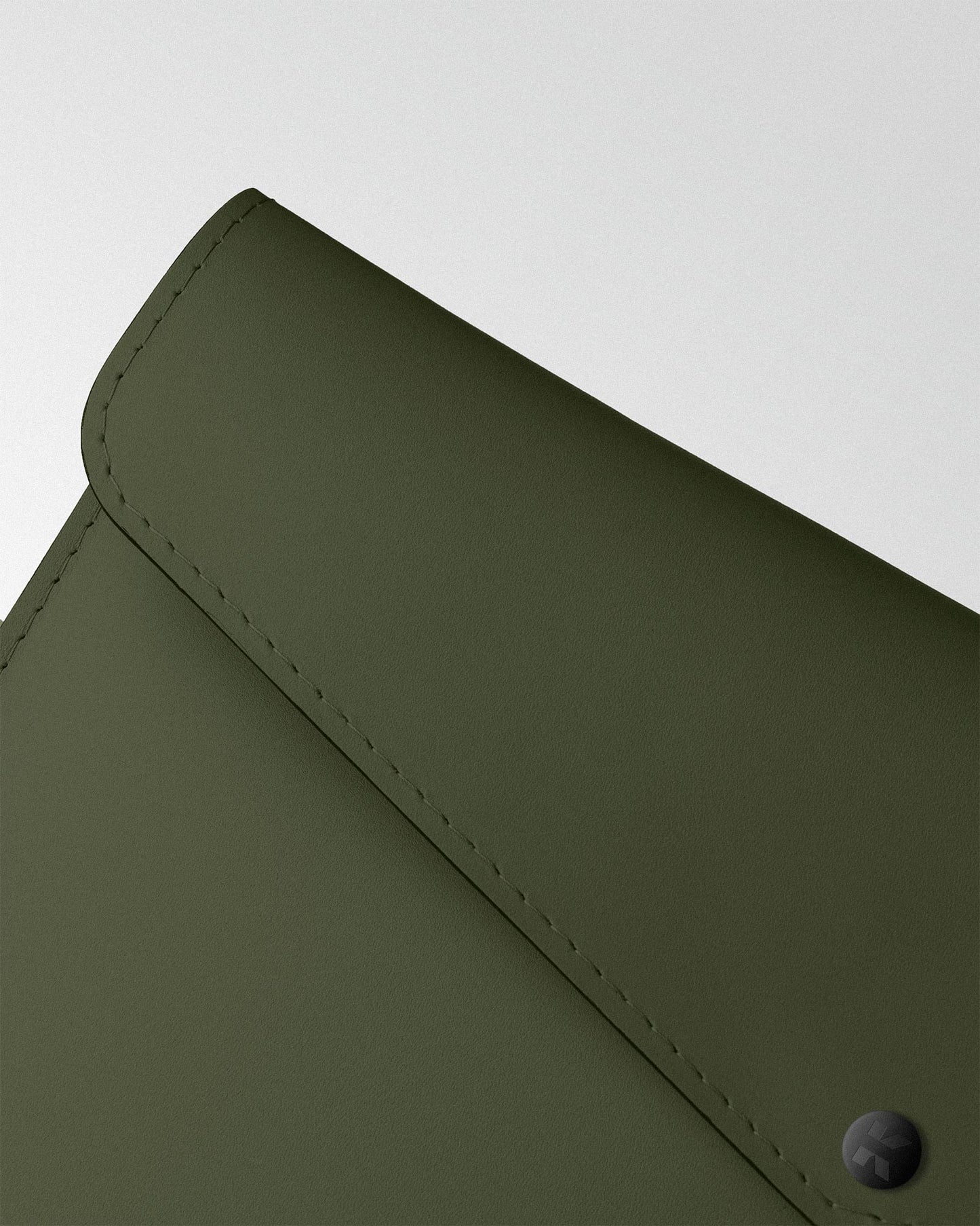 Envelope case in dark green leather for MacBook