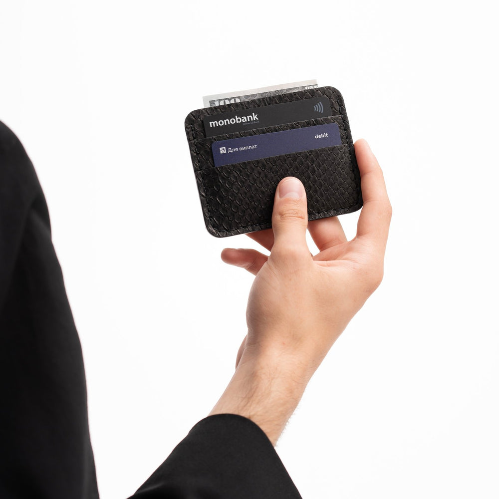 Cardholder made of black python leather with small scales