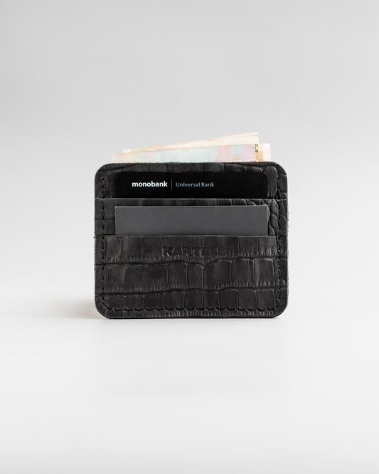 Cardholder made of calfskin, embossed to look like crocodile in black color