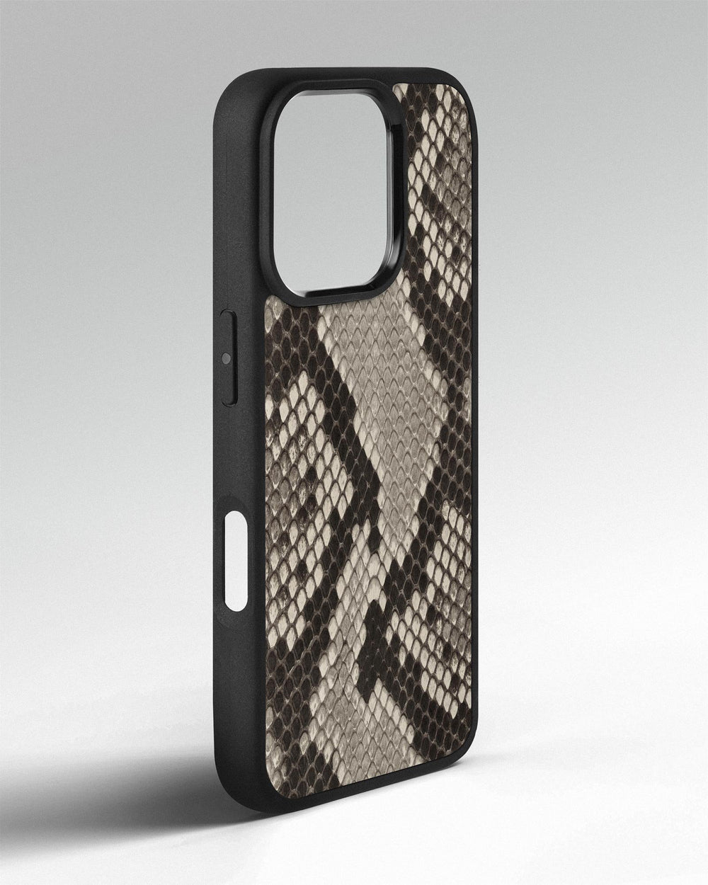 Case made of black and white python leather with small scales for iPhone 16 Pro
